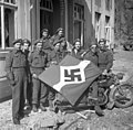 Lake Superior Regiment with captured Hitler Youth flag, Friesoythe, Germany, 16 April 1945