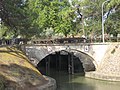 Shows wheels that would transport the walls into place to direct the flow across the canal bed.