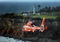 USCG MH-65 flies by