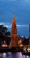 Image 5 Munttoren Photo: Massimo Catarinella The Munttoren, a tower in Amsterdam, the Netherlands, as seen from the river Amstel at dusk. The tower was originally part of the Regulierspoort, one of the main gates in Amsterdam's medieval city wall, dating to 1487. After a fire destroyed the gate in 1618, the tower was rebuilt in the Amsterdam Renaissance style, with an eight-sided top half and open spire designed by Hendrick de Keyser, featuring a clock with four faces and a carillon of bells. The name ("Mint Tower") refers to the time when it was temporarily used to mint coins in the Rampjaar ("disastrous year") of 1672 when both England and France declared war on the Dutch Republic, and silver and gold could not be safely transported to Dordrecht and Enkhuizen, where coins were normally minted. More selected pictures