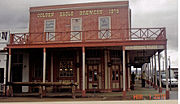 Front view of the Crystal Palace. The Crystal Palace was built in 1879 and is located at 436 E Allen St. Originally known as the Golden Eagle Brewing Company, its' second floor houseed the offices of U.S. Deputy Marshal Virgil Earp. The palace was listed in the National Register of Historic Places on October 15, 1966, as part of the Tombstone Historic District, reference #66000171.