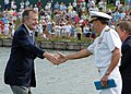 Former President George H. W. Bush shakes hands with Rear Adm. Joseph Kernan and then received the Professional Golfers Association Tour Lifetime Achievement Award.