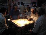 B-5. (Carrom) Nightime game of carrom in Andheri, Mumbai.