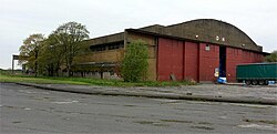 A hangar which is in use, but looks semi-derelict