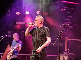 Paul McLoone performing on stage with The Undertones in Dublin, Ireland, on 26 November 2023
