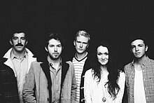 The Paper Kites in 2012. L–R: David Powys, Sam Bentley, Sam Rasmussen, Christina Lacy, Josh Bentley