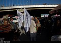 Vendor selling Islamic Emirate flags under Taliban rule (2021)