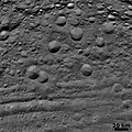 Vestan craters in various states of degradation, with troughs at bottom (6 August 2011)