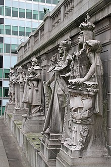 Stone sculptures of seafaring nations on the U.S. Custom House cornice
