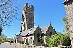 Yellow stone church and tower.