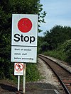A train control sign at St Budeaux Victoria Road station advising drivers to collect the staff before proceeding