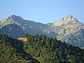 Olonos (on the right), as well as the second highest peak of Erymanthos, Mougila (on the left). View is from the north, showing the col between them.