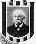 Framed portrait of a white man with a drooping mustache wearing a dark suit coat and bow tie.