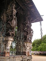 Two pillars with hanging stone chain