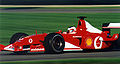 Rubens Barrichello driving the Scuderia Ferrari F2002 at the 2002 United States Grand Prix, showing sponsorship from Vodafone, Shell, and the white space replacing Marlboro at North American and most European races.