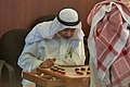 Image 21Two Qataris playing the traditional board game of damah (from Board game)