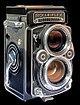 Rolleiflex twin-lens reflex camera, on black background