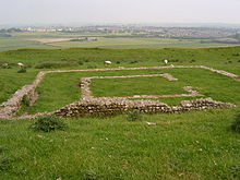 photo of remaining outline in the dirt of the foundation of a Roman temple in England