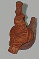 Clay figurine of a sitting woman