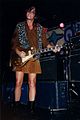 Guitarist Ruthie Morris of Magnapop wearing a leopard print vest on stage.