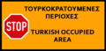 "Stop — Turkish occupied area". Sign of the Republic of Cyprus, where it is placed on the green cease-fire line.