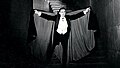 Bela Lugosi as seen in Dracula (1931) adorning a cape.