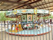 Historic 1912 Parker Carousel located on the grounds of the historic Schnepf Farms .