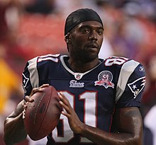 Randy Moss holding a football