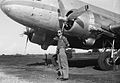 Cees Taillie posing in front of a Dakota on the airfield Mandai (1949)