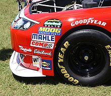 the front of a race car, with the splitter at the bottom