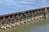 A wooden trestle crossing a body of water