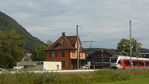 Three-story building with gablet roof