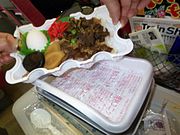 Sukiyaki bento sold at Yonezawa Station, with the heating pack used to heat the contents visible