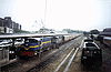 Two diesel locomotives pull a passenger train into Dar es Salaam's main railway station