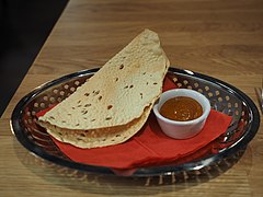 Papadams with chutney are often served as an appetizer at South Asian restaurants around the world.