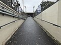 The entrance ramp to the platforms from the underpass, October 2024