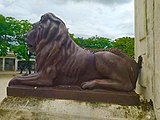 Bronze lion statue and part of Christopher Columbus monument