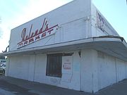 The Roland’s Market building was built in 1917 and is located at 1505 East Van Buren Street. This property is recognized as historic by the Asian American Historic Property Survey.