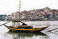 The typical rabelo boat and Porto historical district in background