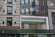 Entrance to the building on 40th Street, with scaffolding and a glass opening framed with a white border