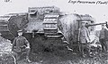 German troops with a captured Mk II tank, showing the unwieldy length of the gun barrel (projecting from sponson on left side of tank).