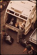 Sanitation workers picking up garbage on 172nd Street in 1973