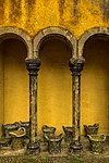 Courtyard archway with stone baskets at Palácio da Pena