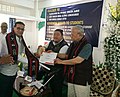 Governor of Nagaland, Padmanabha Acharya felicitating Binod Sethi