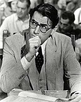 A black and white photograph of Peck as Atticus Finch in To Kill a Mockingbird.