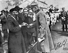 A line of Jewish men shown greeting Marshal Józef Piłsudski