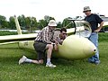 A glider pilot is ground briefed on the Schweizer SGS 1-34 sailplane