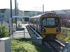 A small railway station with a train