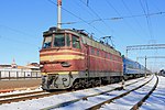 Škoda electric locomotive ChS4-072 with a passenger train at Vinnitsa railway station in 2011