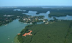 Aerial view of Schmöckwitz, between the lakes Seddinsee (west), Langer See (east) and Zeuthener See (south). In the north, Larger Krampe lake (Müggelheim)